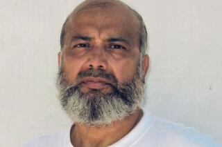 This undated photo made by the International Committee of the Red Cross and provided by lawyer David H. Remes, shows Guantanamo prisoner Saifullah Paracha. A lawyer for the oldest prisoner at the U.S. base at Guantanamo Bay, Cuba, says authorities have approved his release after more than 16 years in custody. Attorney Shelby-Sullivan Bennis says she was notified Monday that the prison review board determined 73-year-old Saifullah Paracha is deemed to no longer pose a threat to U.S. security. The native of Pakistan has been held at Guantanamo since September 2004 for suspected links to al-Qaida but was never charged.  (Provided by David H. Remes via AP)
