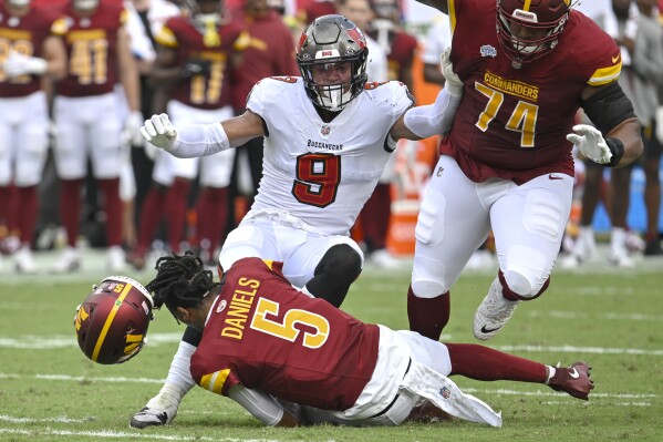 Commanders want Jayden Daniels to 'remain a passer' after running 16 times  in his NFL debut | AP News