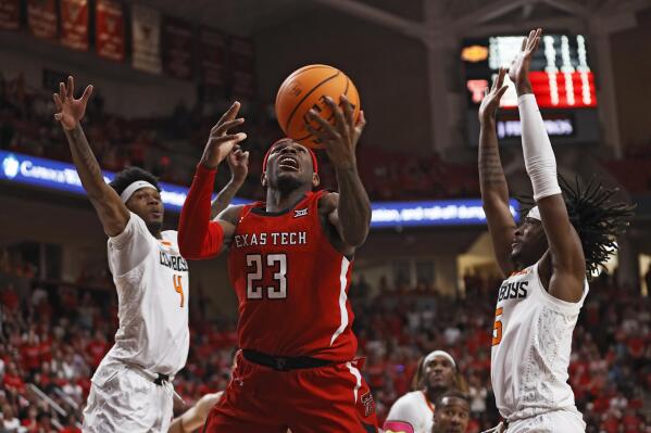 Texas Tech's De'Vion Harmon (23) lays up the ball from between Oklahoma State's Woody Newton (4) and Caleb Asberry (5) during the second half of an NCAA college basketball game Saturday, March 4, 2023, in Lubbock, Texas. (AP Photo/Brad Tollefson)