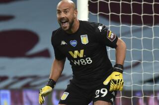 FILE - Aston Villa's goalkeeper Pepe Reina during the English Premier League soccer match between Aston Villa and Arsenal at Villa Park in Birmingham, England, on  July 21, 2020. The veteran goalkeeper is returning to the Spanish league after signing a contract with Villarreal. (AP Photo/Rui Vieira, file)