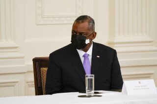 Secretary of Defense Lloyd Austin attends a Cabinet meeting with President Joe Biden in the East Room of the White House, Thursday, April 1, 2021, in Washington. (AP Photo/Evan Vucci)