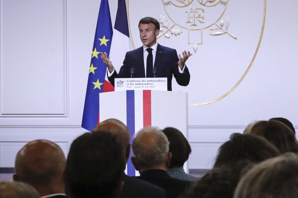 French President Emmanuel Macron gestures as he holds his annual foreign policy speech in front of French ambassadors at the Elysee Palace, in Paris, Monday Aug. 28, 2023. (Teresa Suarez, Pool via AP)