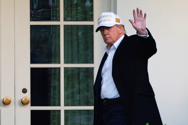 President Donald Trump waves outside the Oval Office as he arrives at the White House, Sunday, April 27, 2025, in Washington. (AP Photo/Manuel Balce Ceneta)