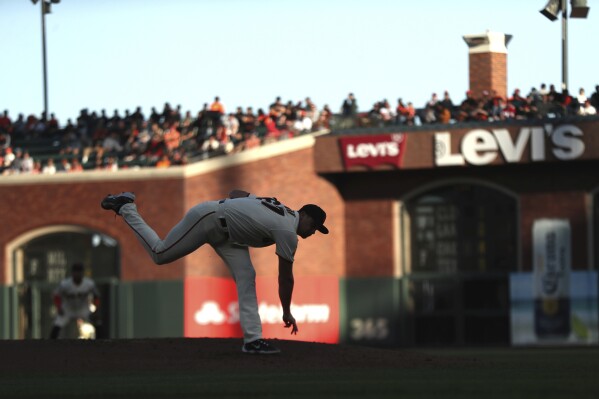 San Francisco Giants' starting pitcher Keaton Winn delivers during the third inning of a MLB baseball game against the Colorado Rockies in San Francisco, Saturday, Sept. 9, 2023. (Stephen Lam/San Francisco Chronicle via AP)