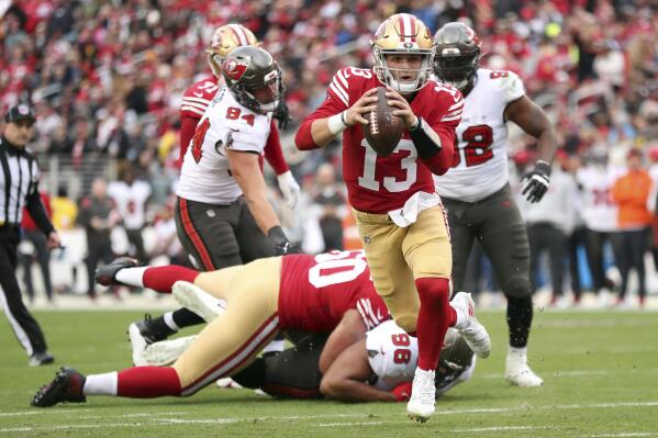 San Francisco 49ers' Brock Purdy rushes for a touchdown against the Tampa Bay Buccaneers during the second quarter of an NFL football game at Levi's Stadium in Santa Clara, Calif., Sunday, Dec. 11, 2022. (Scott Strazzante/San Francisco Chronicle via AP)