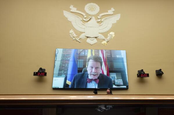 FILE - Food and Drug Administration Commissioner Robert Califf testifies via video during a House Commerce Oversight and Investigations subcommittee hybrid hearing on the nationwide baby formula shortage on Wednesday, May 25, 2022, in Washington. Califf has spent much of his last year on the job warning that growing “distortions and half-truths” surrounding vaccines and other medical products are a major driver of sickness and death in America. (AP Photo/Kevin Wolf, File)