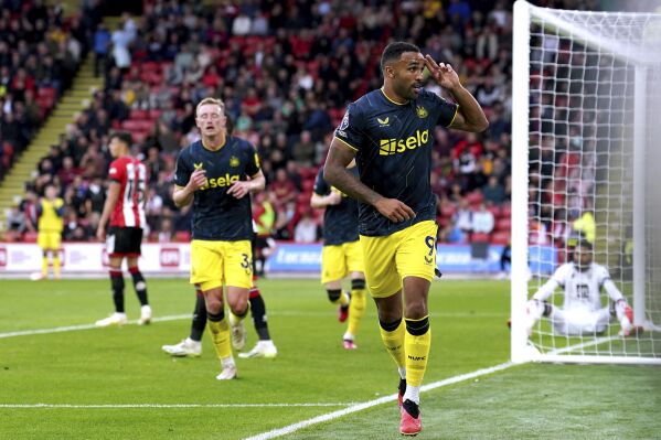 Newcastle United's Callum Wilson celebrates scoring his side's fourth goal of the game, during the English Premier League soccer match between Sheffield United and Newcastle United, at Bramall Lane, in Sheffield, England, Sunday, Sept. 24, 2023. (Martin Rickett/PA via AP)