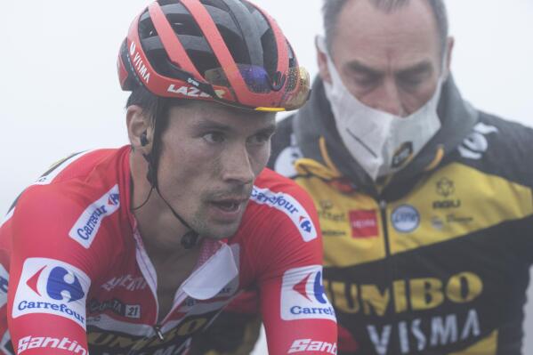 Primoz Roglic of Slovenia crosses the line in second place in the 18th stage between Salas and Alto de Gamoniteiro, during La Vuelta cycling race in Spain, Thursday Sept. 2, 2021. (AP Photo/Lalo R. Villar)