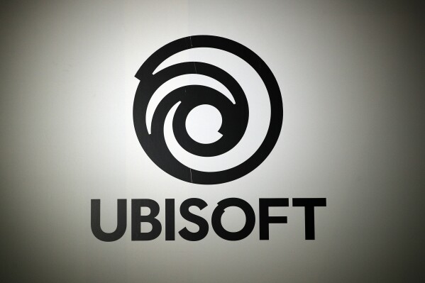FILE - The logo of French video game publisher Ubisoft is pictured at the Paris games week in Paris, Nov. 4, 2017. (AP Photo/Christophe Ena, File)