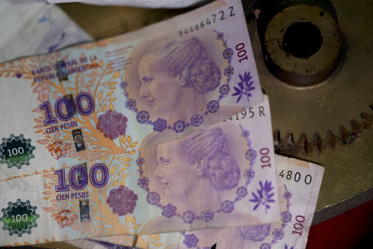 Argentine banknotes printed with the face of former first lady Maria Eva Duarte de Peron, better known as Eva Peron, are displayed at the Peron Peron restaurant in the San Telmo neighborhood of Buenos Aires, Argentina, Friday, Feb. 9, 2024 went.  (AP Photo/Natacha Pisarenko)