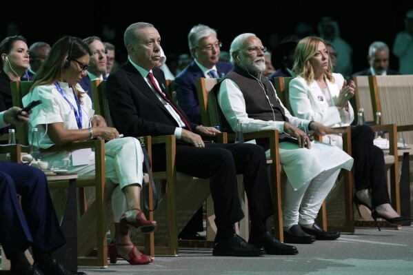 Turkey President Recep Tayyip Erdogan, center left, and India Prime Minister Narendra Modi, center right, attend an opening ceremony at the COP28 U.N. Climate Summit, Friday, Dec. 1, 2023, in Dubai, United Arab Emirates. (AP Photo/Rafiq Maqbool)