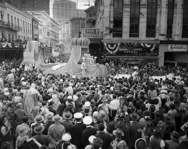 A general view of "Rex", king of the New Orleans Mardi Gras parade, leads the way through thousands of revelers packed in the streets, March 6, 1946. The float is about to turn from St. Charles Avenue into Canal Street. (AP Photo,file)