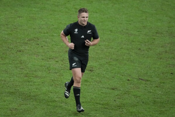 FILE - New Zealand's Sam Cane leaves the pitch after being shown the yellow card during the Rugby World Cup final match between New Zealand and South Africa at the Stade de France in Saint-Denis, near Paris on Oct. 28, 2023. The man who worked as the television match official for this year's Rugby World Cup final stepped away from the international game "for the foreseeable future" on Monday Dec. 4, 2023, saying a “torrent of criticism and abuse online” led him to the decision. Tom Foley made a series of big calls in the title match between New Zealand and South Africa in October, including recommending a red card for All Blacks captain Sam Cane in the first half. The Springboks won the game 12-11. (AP Photo/Themba Hadebe, File)