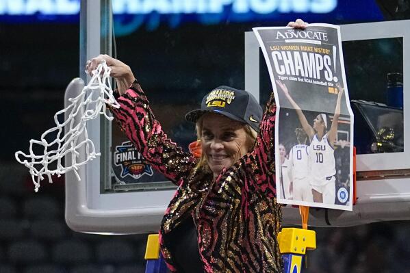 LSU head coach Kim Mulkey celebrates after cutting down the net after the NCAA Women's Final Four championship basketball game against Iowa Sunday, April 2, 2023, in Dallas. LSU won 102-85 to win the championship. (AP Photo/Tony Gutierrez)