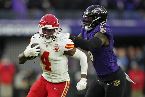 FILE - Kansas City Chiefs wide receiver Rashee Rice (4) is tackled by Baltimore Ravens linebacker Patrick Queen (6) during the first half of the AFC Championship NFL football game, Jan. 28, 2024, in Baltimore. Kansas City Chiefs receiver Rashee Rice is suspected of assault in Dallas a little over a month after he was one of the speeding drivers in a chain-reaction crash that led to multiple charges, according to a newspaper report Tuesday, May 7, 2024. (AP Photo/Matt Slocum, File)
