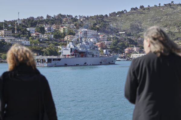 An Italian navy ship approaches the port , as Italian authorities transfer 40 migrants with no permission to remain in the country to Italian-run migration detention centers in Albania, in Shengjin, northwestern Albania, Friday, April 11, 2025. (AP Photo/Vlasov Sulaj)