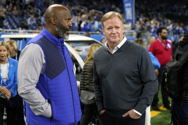 Detroit Lions general manager Brad Holmes, left, talks with NFL Commissioner Roger Goodell before the first half of an NFL football game, Sunday, Nov. 19, 2023, in Detroit. (APPhoto/Paul Sancya)
