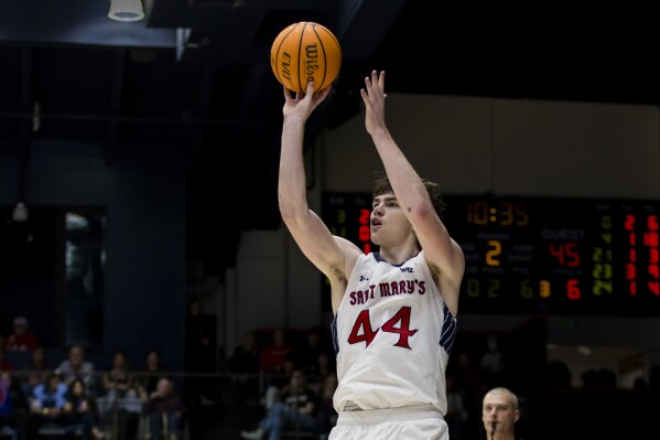 Saint Mary's guard Alex Ducas takes a 3-point shot against San Diego during the second half of an NCAA college basketball game in Moraga, Calif., Saturday, Feb. 24, 2024. (AP Photo/John Hefti)