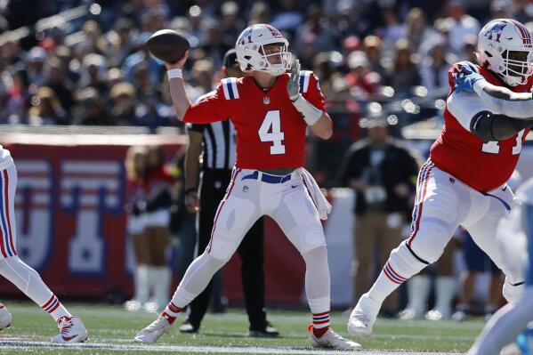 New England Patriots quarterback Bailey Zappe (4) winds up to pass during the first half of an NFL football game against the Detroit Lions, Sunday, Oct. 9, 2022, in Foxborough, Mass. (AP Photo/Michael Dwyer)