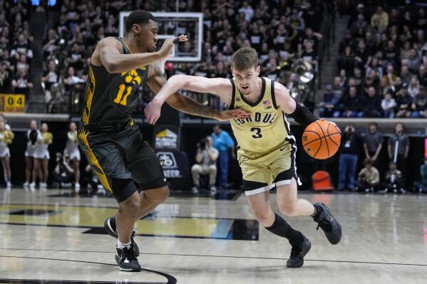 Purdue guard Braden Smith (3) drives on Iowa guard Tony Perkins (11) during the second half of an NCAA college basketball game in West Lafayette, Ind., Thursday, Feb. 9, 2023. Purdue defeated Iowa 87-73. (AP Photo/Michael Conroy)