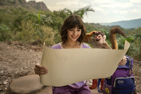 Lorraine, center, and Boots, voiced by Gabriel "Fluffy" Iglesias, in a scene from "Dora and the Search for Sol Dorado." (Nickelodeon/Paramount+ via AP)