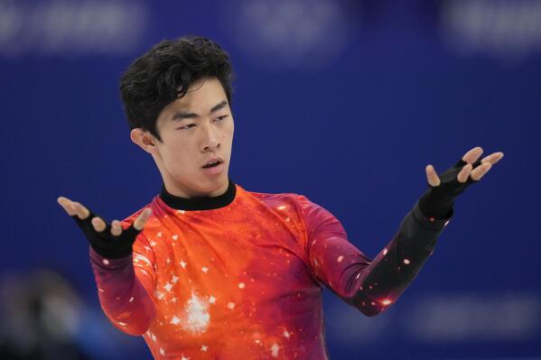 FILE - Nathan Chen competes in the men's free skate program during the figure skating event at the 2022 Winter Olympics, Thursday, Feb. 10, 2022, in Beijing. Nathan Chen withdrew from the world championships on Wednesday, March 16, because of what he called a “nagging injury” that he’s been dealing with after winning at the Beijing Games. (AP Photo/Natacha Pisarenko, File)