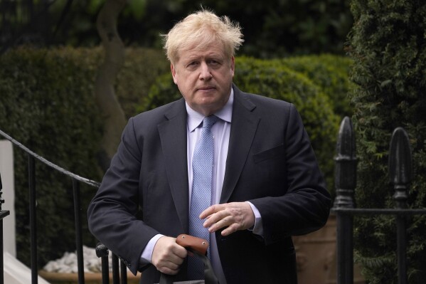 FILE - Boris Johnson leaves his house in London, on March 22, 2023. A U.K. court on Thursday, July 6, 2023, rejected the British government's request to keep former Prime Minister Boris Johnson's unredacted WhatsApp messages and diaries from being made public at an official COVID-19 inquiry. (AP Photo/Alberto Pezzali, File)