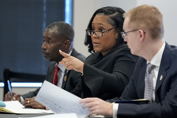 Fulton County District Attorney Fani Willis speaks in court in the Fulton county courthouse, Tuesday, July 11, 2023, in Atlanta. A grand jury being seated Tuesday in Atlanta will likely consider whether criminal charges are appropriate for former President Donald Trump or his Republican allies for their efforts to overturn his 2020 election loss in Georgia. (AP Photo/Brynn Anderson)