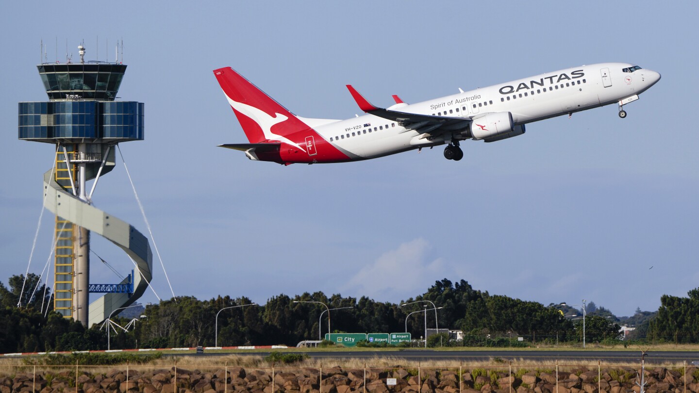 КАНБЕРА Австралия AP — Qantas Airways се съгласи да плати