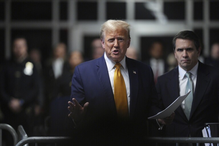 Former President Donald Trump talks to the media outside Manhattan criminal court in New York, on Tuesday, May 14, 2024. (Curtis Means/Pool Photo via AP)