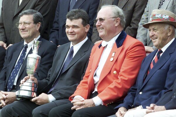 FILE - Former British Open champions from left: Peter Thomson, Paul Lawrie, Sir Michael Bonallack, Captain of the R&A Golf Club, and Sam Snead are shown during a photocall of past and present Open champions in front of the clubhouse on the Old Course at St. Andrews in Scotland Tuesday July 18, 2000. Sir Michael Bonallack once said he never considered turning pro because he didn't realize he was good enough until he was too old. No matter. His influence on the game was enormous, from his standing as Britain's greatest amateur to his running the Royal & Ancient Golf Club. Bonallack died on Tuesday, Sept. 26, 2023, at age 88, a month after he made one last appearance at St. Andrews for the opening ceremony of the Walker Cup. (AP Photo/Alistair Grant, File)