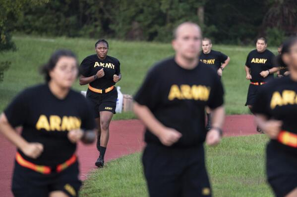 U.S. Military recruits are sworn in during halftime on Salute to