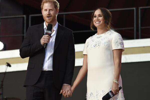 FILE - Prince Harry and Meghan, the Duke and Duchess of Sussex, appear at Global Citizen Live in Central Park on Sept. 25, 2021, in New York. The couple will receive the President’s Award during the 53rd NAACP Image Awards on Feb. 26. (Photo by Evan Agostini/Invision/AP, File)
