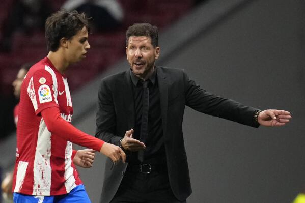 FILE - Atletico Madrid's head coach Diego Simeone, right, talks to Joao Felix during the La Liga soccer match between Atletico Madrid and Real Sociedad at the Estadio Wanda Metropolitano in Madrid, on Oct. 24, 2021. (AP Photo/Manu Fernandez, File)