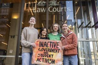 FILE - Laura Kirwin, Izzy Raj-Seppings, Ava Princi and Liv Heaton pose for a photo outside The Federal Court of Australia in Sydney, Australia on May 27, 2021. An appeals court has overturned a groundbreaking ruling, Tuesday March 15, 2022, that Australia's environment minister has a duty to protect younger people against climate change. (James Gourley/AAP Image via AP, File)