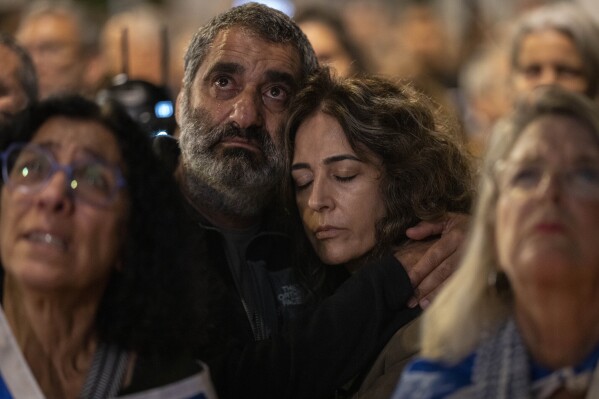 People attend a demonstration against Israeli Prime Minister Benjamin Netanyahu's government outside the Knesset, Israel's parliament in Jerusalem, Tuesday, Nov. 7, 2023. (AP Photo/Bernat Armangue)