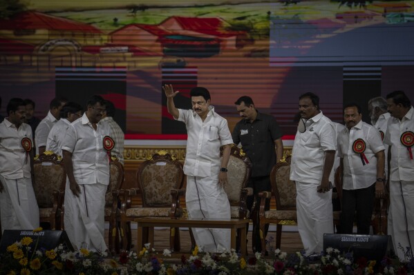 Dravida Munnetra Kazhagam (DMK) leader and Chief Minister of Tamil Nadu state, M. K. Stalin, center, greets his supporters as he arrives to address them during an election campaign rally ahead of country's general elections, on the outskirts of southern Indian city of Chennai, April 15, 2024. (AP Photo/Altaf Qadri)