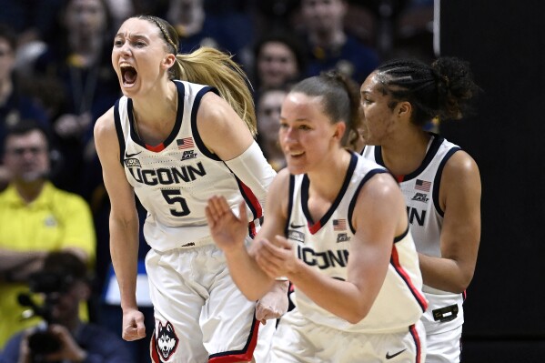 UConn guard Paige Bueckers (5) reacts in the first half of an NCAA college basketball game against Marquette in the semifinals of the Big East Conference tournament, Sunday, March 10, 2024, in Uncasville, Conn. (AP Photo/Jessica Hill)