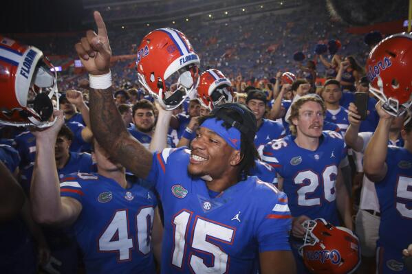 FILE - Florida quarterback Anthony Richardson (15) celebrates with teammates after an NCAA college football game against South Carolina on Saturday, Nov. 12, 2022, in Gainesville, Fla. Bryce Young, C.J. Stroud, Anthony Richardson and Will Levis are projected to go anywhere from the top 5 to top 15 picks in this draft. (AP Photo/Matt Stamey, FIle)