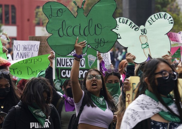 A woman holds up a sign with a message in Spanish; "I will decide" as she joins a march demanding legal, free and safe abortions for all women, marking International Safe Abortion Day, in Mexico City, September 28, 2022. Mexico's Supreme Court, Wednesday, September 6 2023, decriminalized abortion nationwide.  (AP Photo/Marco Ugarte, file)