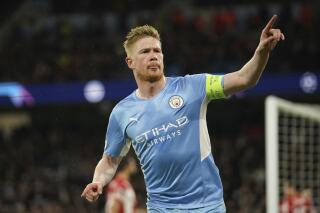 Manchester City's Kevin De Bruyne celebrates after scoring his side's opening goal during the Champions League, first leg, quarterfinal soccer match between Manchester City and Atletico Madrid at the Etihad Stadium, in Manchester, Tuesday, April 5, 2022. (AP Photo/Dave Thompson)