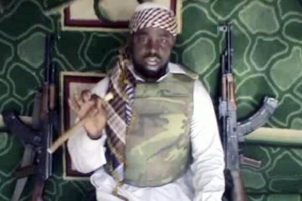 FILE - This file image taken from video posted by Boko Haram sympathizers made available on Wednesday, Jan. 10, 2012, shows Abubakar Shekau, the leader of the radical Islamist sect Boko Haram.  The leader of Nigerian extremist group Boko Haram, Abubakar Shekau, has killed himself, according to a jihadi group linked to the Islamic State group, according to an audio message heard this week.  (AP Photo, File) THE ASSOCIATED PRESS CANNOT INDEPENDENTLY VERIFY THE CONTENT, DATE, LOCATION OR AUTHENTICITY OF THIS MATERIAL