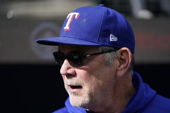 Texas Rangers manager Bruce Bochy looks on from the dugout before a baseball game against the Seattle Mariners, Sunday, Oct. 1, 2023, in Seattle. (AP Photo/Lindsey Wasson)