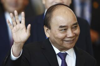 FILE - Vietnam's President Nguyen Xuan Phuc arrives at the APEC Economic Leaders Meeting during the Asia-Pacific Economic Cooperation, also known as APEC summit, Saturday, Nov. 19, 2022, in Bangkok, Thailand. Nguyen Xuan Phuc resigned Tuesday, Jan. 17, 2023, the most senior member of the communist state’s government to be forced from his job after a series of high-profile corruption scandals for which he was held responsible. (Jack Taylor/Pool Photo via AP, File)