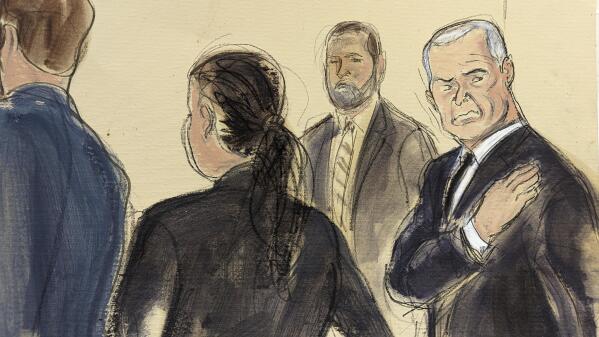 In this courtroom sketch, Genaro García Luna, right, puts his hand on his heart as he stands with his defense team, while the jury files out of the courtroom, Tuesday, Feb. 21, 2023, in federal court in New York. The former Mexican presidential cabinet member was convicted Tuesday of taking massive bribes to protect the violent drug cartels he was tasked with combating. A U.S. Marshal stands in the background. (AP Photo/Elizabeth Williams)