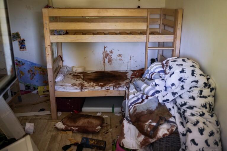 Blood is seen splattered in a child's room following a massive Hamas militant attack in Kibbutz Nir Oz, Israel, Thursday, Oct. 19, 2023. Nir Oz is one of more than 20 towns and villages in southern Israel that were ambushed in the sweeping assault by Hamas on Oct. 7. (AP Photo/Francisco Seco)