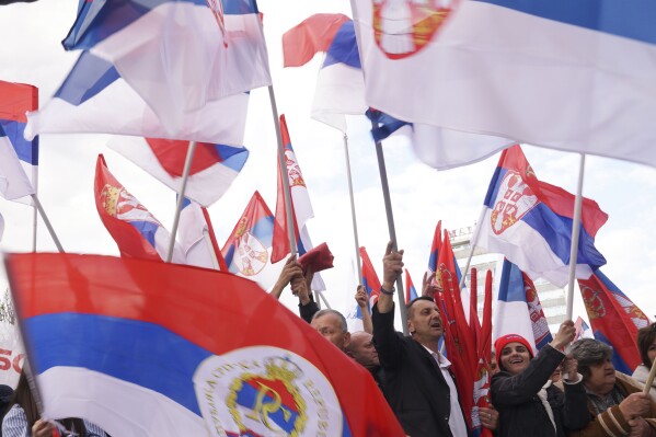 Supporters of Bosnian Serb political leader Milorad Dodik wave Serbian flags during protest against what he claims is Western aggression against Republika Srpska entity in the Bosnian town of Banja Luka, 240 kms northwest of Sarajevo, Thursday, April 18, 2024. (AP Photo/Radivoje Pavicic)