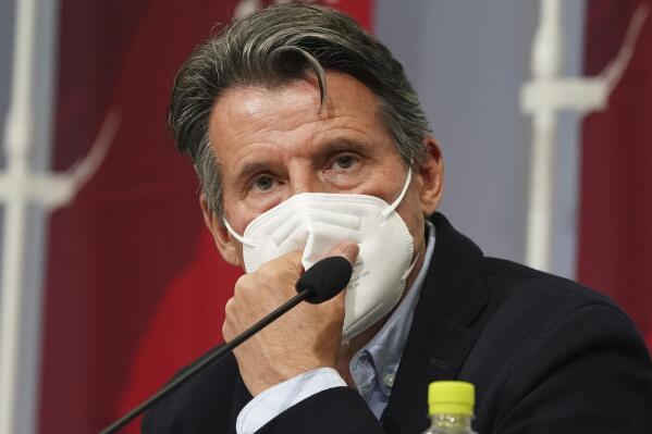 FILE - Sebastian Coe, president of World Athletics, listens to a reporter's question during a press conference as Coe visited an athletics test event for the Tokyo 2020 Olympics Games at National Stadium in Tokyo, Sunday, May 9, 2021. With track and field adding another Diamond League event in China, World Athletics president Sebastian Coe addressed the human rights issues in the country during his state-of-the-sport talk Tuesday, Dec. 21, 2021. (AP Photo/Shuji Kajiyama, File)