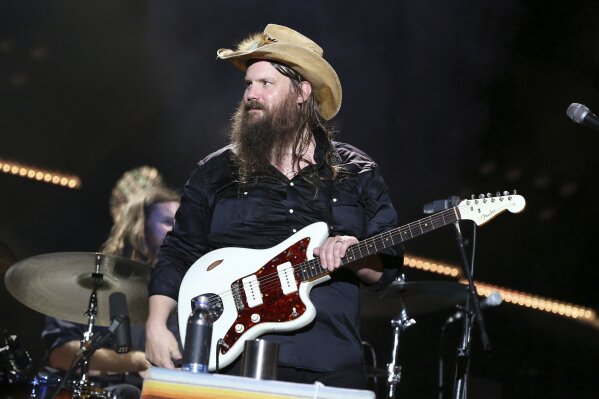 
              FILE - In this June 9, 2018 file photo, Chris Stapleton performs at the 2018 CMA Music Festival in Nashville, Tenn. Stapleton's “Broken Halos” is nominated for single of the year and song of the year for the Country Music Association Awards. (Photo by Laura Roberts/Invision/AP, File)
            