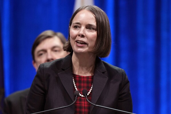 FILE - Maine Secretary of State Shenna Bellows speaks at the inauguration of Gov. Janet Mills, Jan. 4, 2023, at the Civic Center in Augusta, Maine. A swatting call was made Friday, Dec. 29, 2023, to the home of Bellows. A man called emergency services saying he broke into a house in Manchester, Maine, which turned out to be Bellows' home. No one was home at the time, and responding officers found nothing suspicious. (AP Photo/Robert F. Bukaty, File)